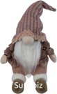 Soft toy Gnome in a fur coat sitting. Color: pink. Size: 18x16x37 cm.