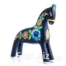 A black horse with a blue flower
